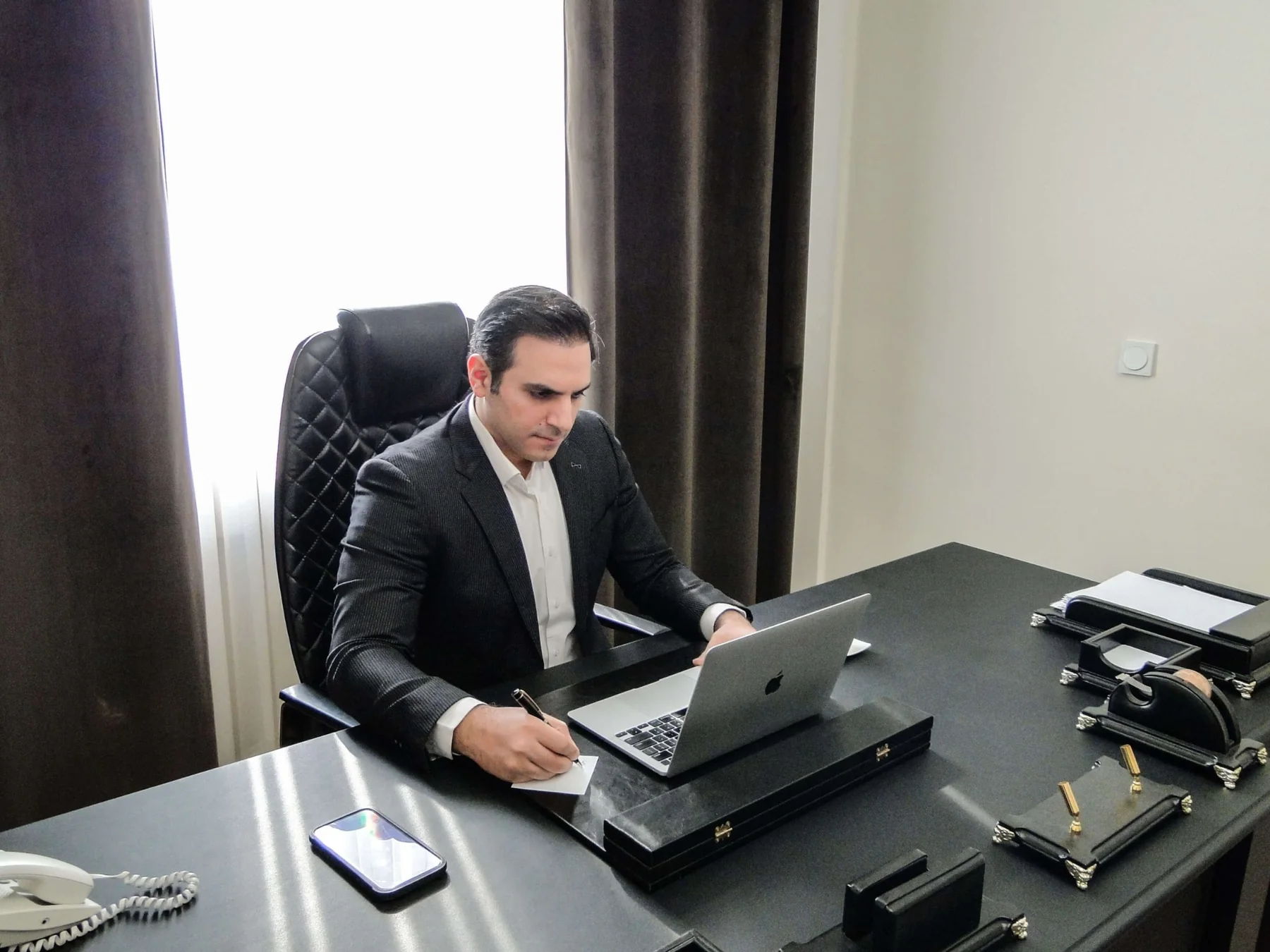 Dr. Jason Shahdost at his desk